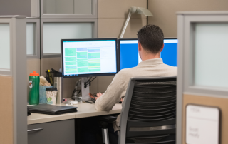AWC_SYF_HRCA_2833_scaled Employee working at a computer