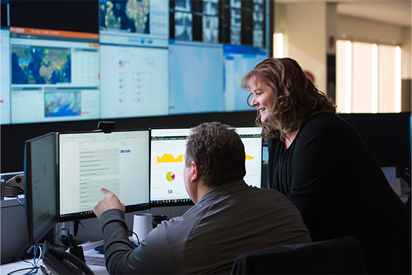 D&A-4 two employees working at a computer