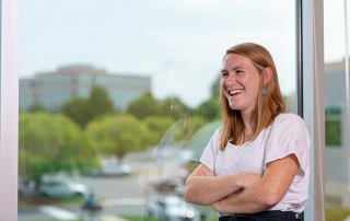 SRM-4 Woman with arms crossed smiling
